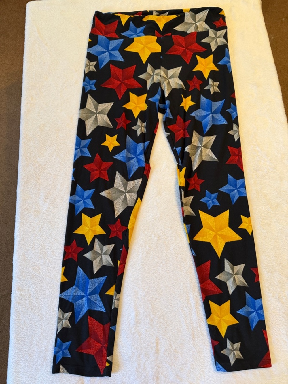 LuLaRoe Black Leggings with Red, Blue, Yellow & Gray Star Print